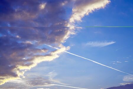 Contrails and clouds in the sky