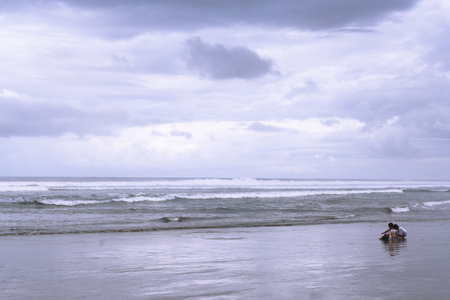 Surfer on the beach of the Atlantic ocean in Costa Rica.