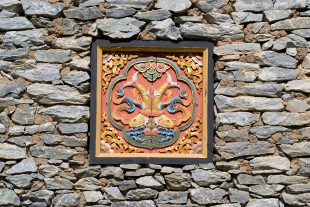 Wood carving in stone wallの写真素材
