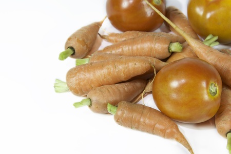 tomatoes and carrots isolate on white backgroundの写真素材