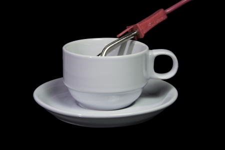 Electric Thermal Tube and cup isolate on blackbackgroundの写真素材