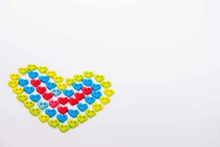 Colorful heart button on white backgroundの写真素材