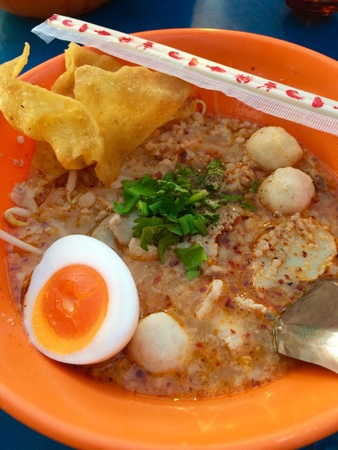 Spicy noodles with pork, egg and meatballs.の素材
