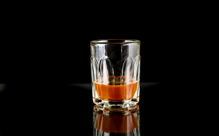 Shot glass on black backgroundの素材