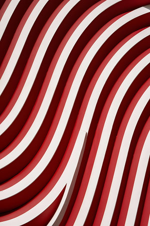 a red and white striped wall with a white stripeの素材