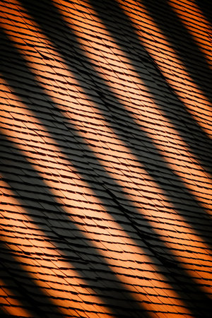 a roof with a shadow of the sun on itの素材