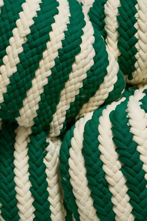 a pile of green and white pillowsの素材