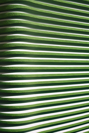 a green and white striped wall with a white backgroundの素材