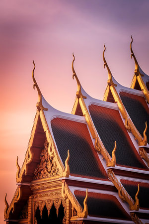 a row of buddhist buildings with a pink sky in the backgroundの素材
