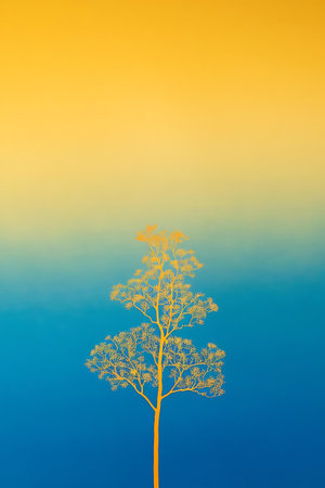 a tree with a yellow sky in the backgroundの素材