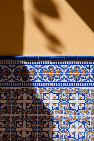 a blue and white tile with orange and blue patternsの素材