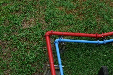 blue and red pipes on the floor                        の写真素材