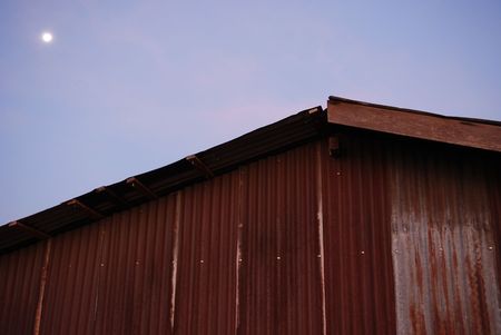 wooden house, moon in the morning at countrysideの写真素材