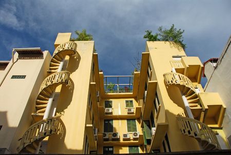 hold house and stair case in the cityの写真素材