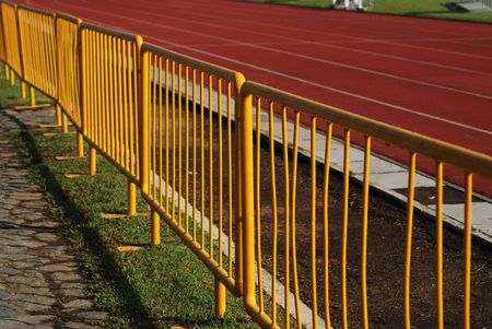 yellow fences and track at the sport centre 