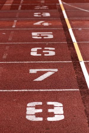 numbers marks on the tracks field in the stadiumの写真素材