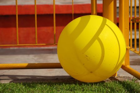 big yellow color balloon on the football field の写真素材