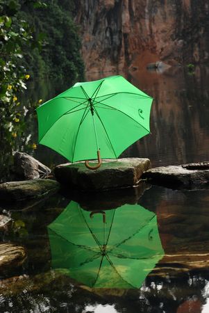 colorful umbrella reflection at the pond side の写真素材