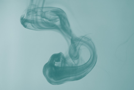 Ink diffusion in the water in the jugs の写真素材