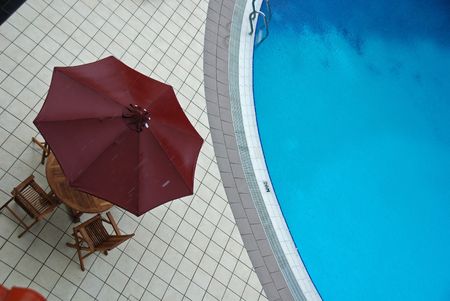swimming pool and umbrella の写真素材