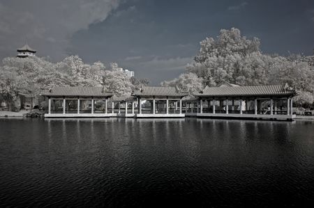 infrared photo - lake, chinese house and tree in the parks の写真素材