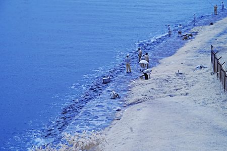 seaside and man fishingの写真素材