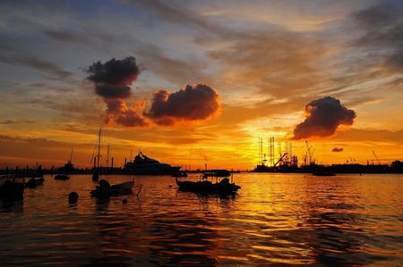 sunset and boat at the seasideの写真素材