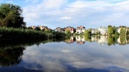 Fresh air after rain holiday residence by natural  lake with beautiful reflectionの写真素材