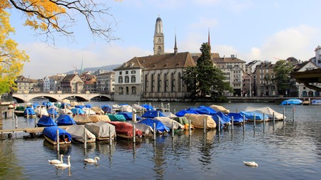 River view boat white swan building church autumn in Zurich Switzerlandのeditorial素材