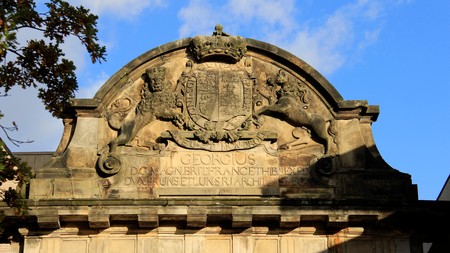 Art of old city gate. crown and lion detail in Hannover Germany