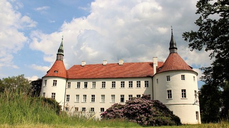 Historic building of fuerstlich drehna palace and bloomine of rhododendren in Luckau germanyのeditorial素材