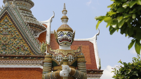 One of colorful guarding titan decoration with mosaic in wat arun temple Bangkok Thailandの写真素材