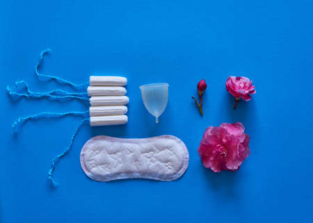 The evolution of a menstrual cycle from light to heavy flow - flat lay, concept