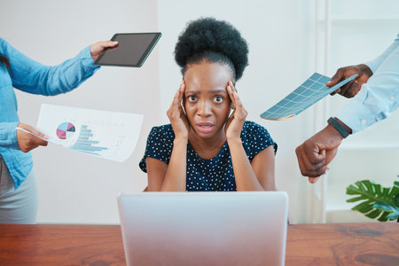 Young business woman stressed, concept of demanding coworkers deadlines pressureの写真素材