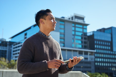 Confident Young Entrepreneur Using Tablet in Urban Cityscape, Digital Business