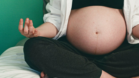 Pregnant Woman Practicing Meditation in a Peaceful Setting, Embracing Relaxation and Well-being