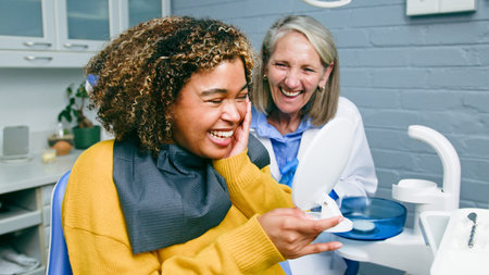 Smiling Patient and Dentist Share a Moment of Joy in a Dental Office
