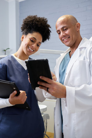 Healthcare Professionals Collaborating in a Clinical Setting for Patient Careの写真素材