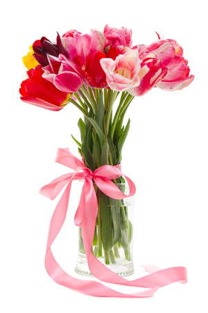 bouquet of beautiful tulips in a vase on a white backgroundの写真素材