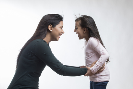 Portrait of mother and daughter Laughingの写真素材