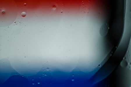 Oil drops on the water の写真素材