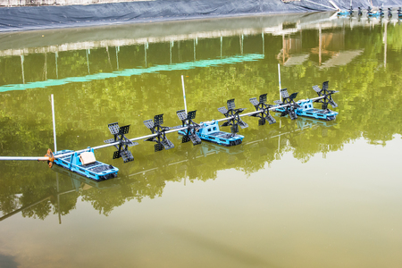 Aeration machine working in the water.の写真素材