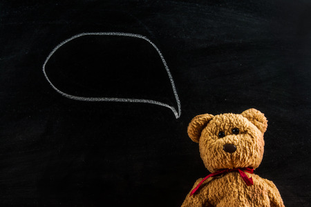 teddy bear with blackboard , backgroundの写真素材