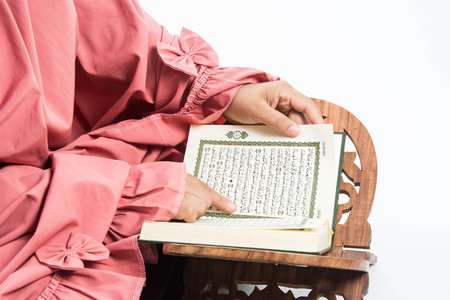 Koran  holy book of Muslims( public item of all muslims )Koran whith muslims woman