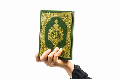 Koran in hand - holy book of Muslims( public item of all muslims )Koran in hand muslims womanの写真素材