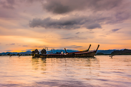 fishing boat  at sunset .Thailandの写真素材