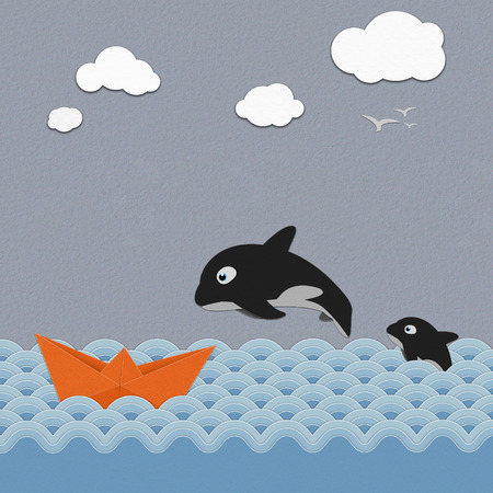 Origami boat  and  Orcinus orca  on the  sea ,paper artの写真素材
