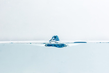 Water splash with bubbles of air, isolated on the white backgroundの写真素材
