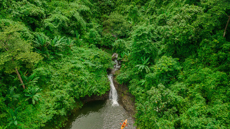 Waterfall in the middle of the forest. Bird eye view , droneの写真素材