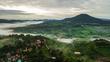 Mountains with trees and fog .の写真素材